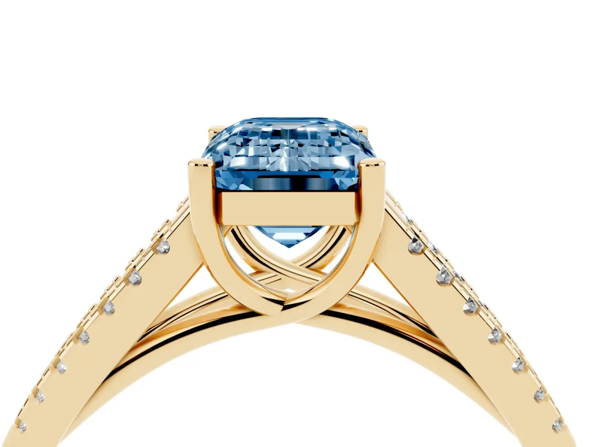 Fancy Blue Emerald Cut Diamond Solitaire Engagement Ring with Split Shank Pavé Band Yellow gold