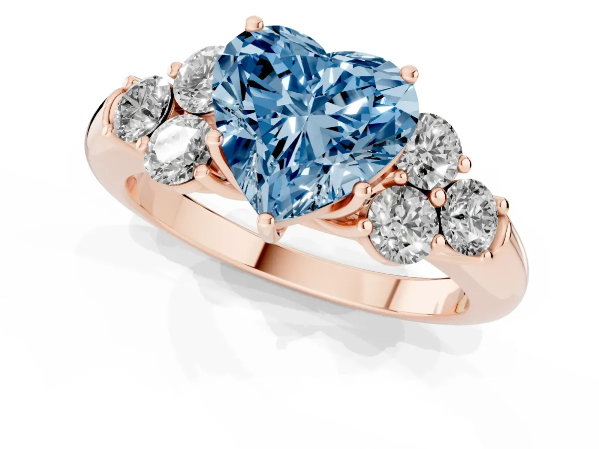 Fancy Blue Heart Cut Cut Diamond Cluster Ring with Round Accent Stones and Prong Setting on a Classic Band Rose gold