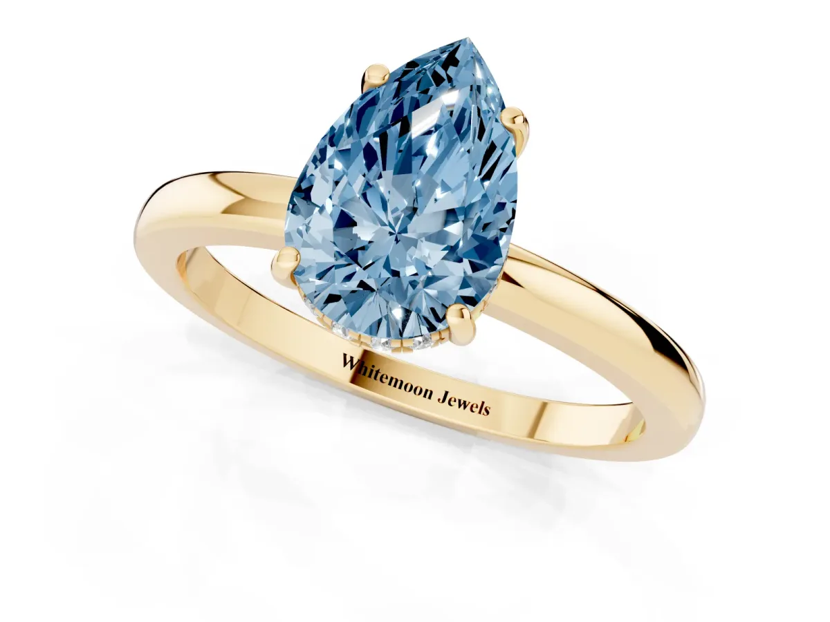 Fancy Blue Pear Cut Solitaire Diamond Ring with Prong Setting and Plain Band Yellow gold