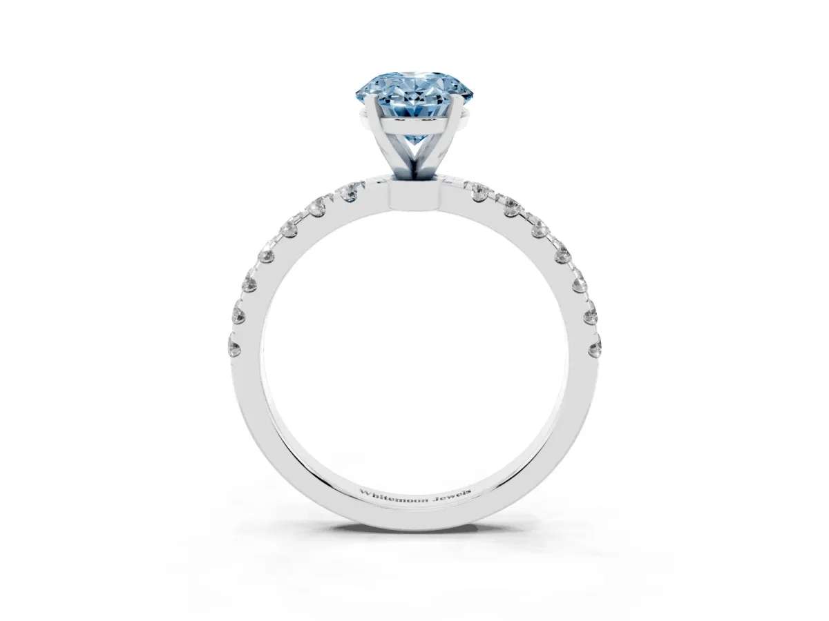 Fancy Blue Oval Cut Diamond Solitaire Ring with Pavé Accents and Four-Prong Setting Silver