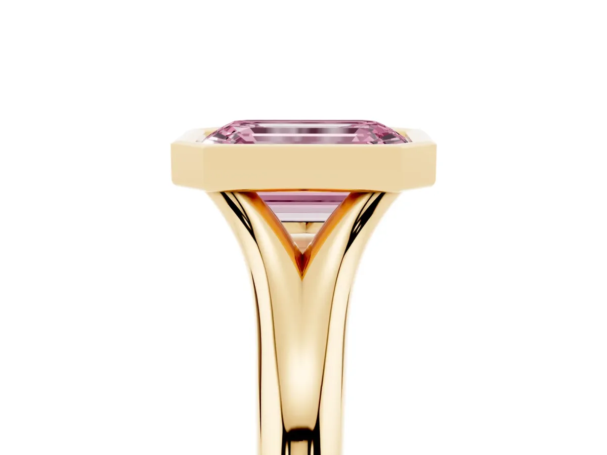 Fancy Pink Bezel Set Emerald Cut Solitaire Diamond Ring with Smooth Band Yellow gold