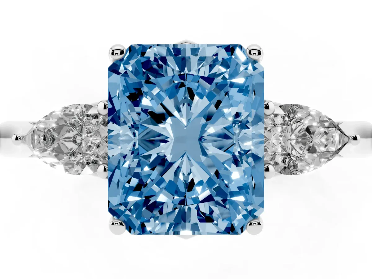 Fancy Blue Three-Stone Radiant Cut Diamond Ring with Pear Side Stones in Four-Prong Setting Platinum