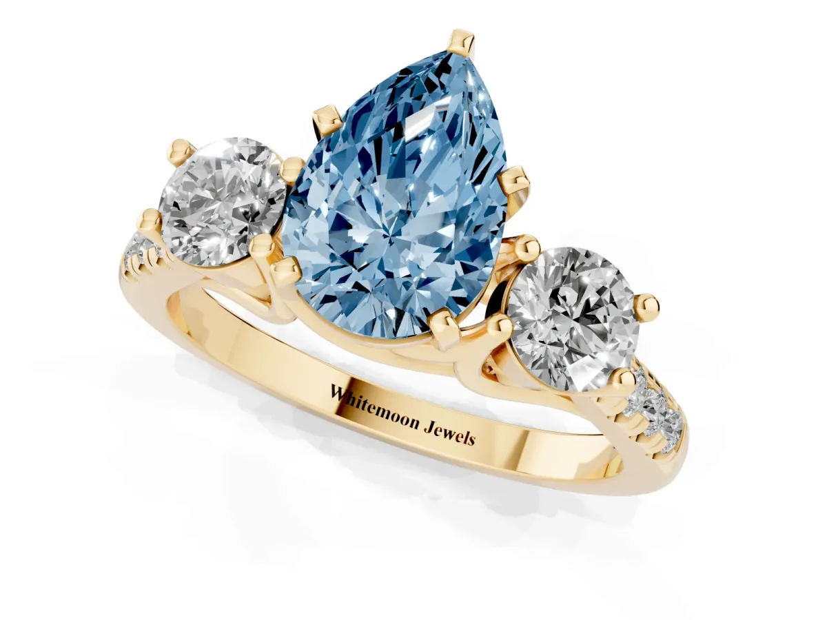 Fancy Blue Three-Stone Pear Cut Diamond Pavé Band with Four-Prong Setting Yellow gold
