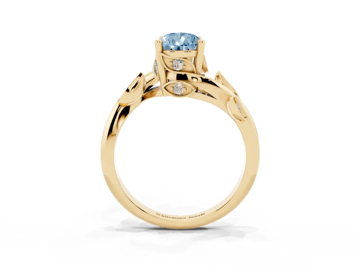 Fancy Blue Pear Cut Solitaire Twist Engagement Ring with Leaf Accents and Prong Setting Yellow gold