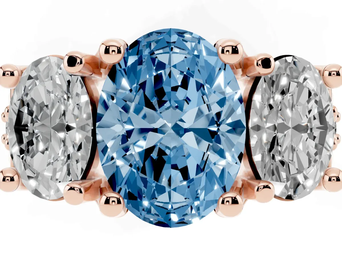 Fancy Blue Oval Cut Diamond Three-Stone Ring with Channel Set Band and Four-Prong Setting Rose gold