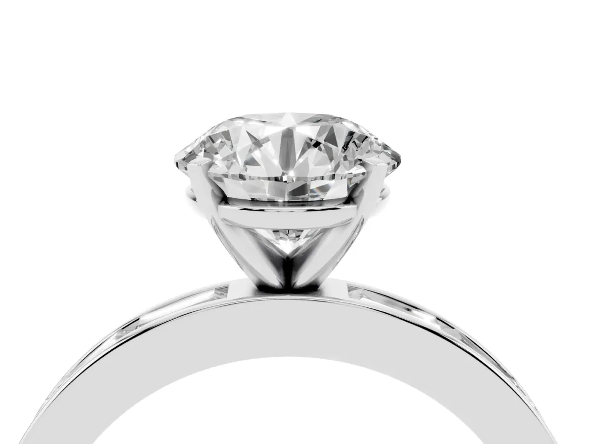Round Cut Solitaire Diamond Ring with Channel-Set Baguette Band and Four-Prong Setting White gold