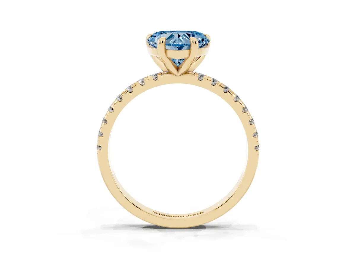 Fancy Blue Heart Cut Diamond Brilliant Solitaire Ring with Pavé Band and Four-Prong Setting Yellow gold