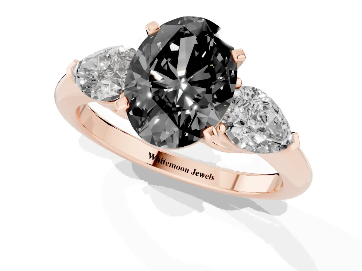 Fancy Black Three-Stone Oval Cut Diamond Ring with Pear Side Stones and Four-Prong Setting Rose gold