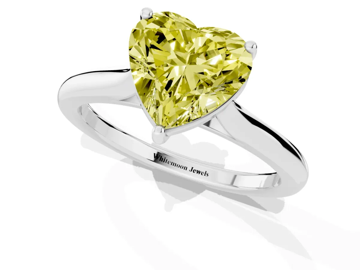 Fancy Yellow Heart Cut Cut Solitaire Ring with Cathedral Band and Four-Prong Setting Silver