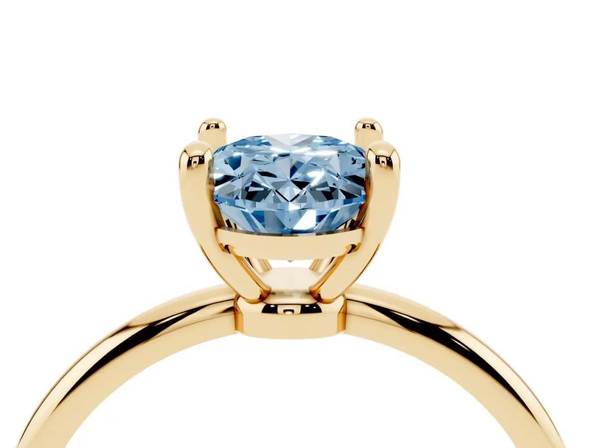 Fancy Blue Oval Cut Solitaire Diamond Ring with 4-Prong Setting on a Classic Band Yellow gold