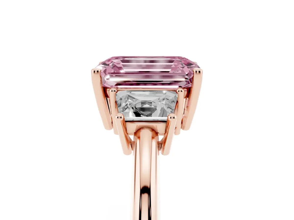 Fancy Pink Emerald Cut Diamond Three-Stone Ring with Trapezoid Side Stones and Prong Setting Rose gold