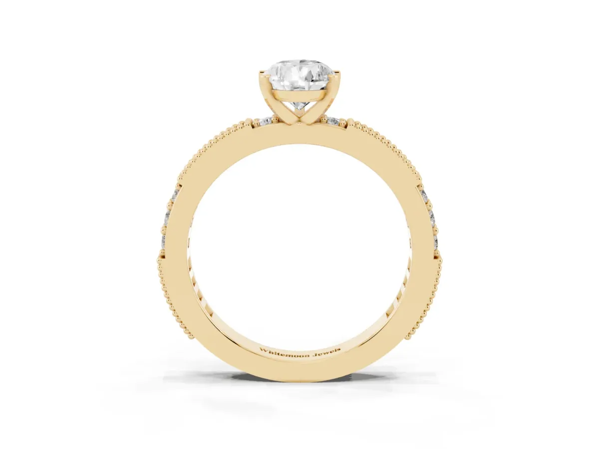 Pear Cut Solitaire with Pavé Band and Four-Prong Setting Yellow gold