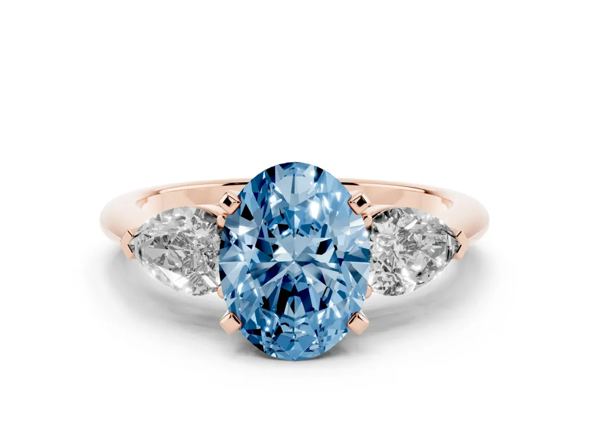 Fancy Blue Three-Stone Oval Cut Diamond Ring with Pear Side Stones and Four-Prong Setting Rose gold