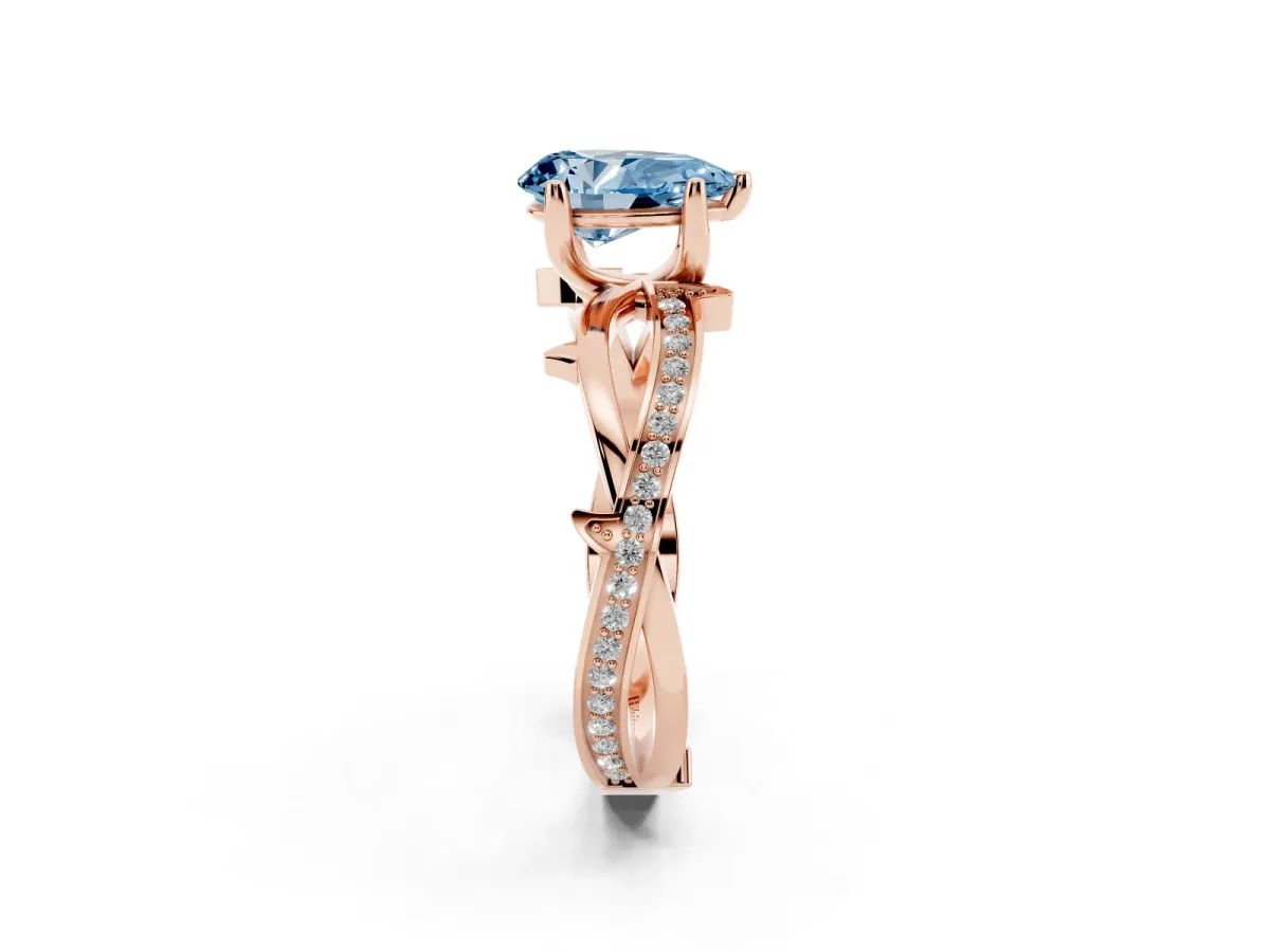 Fancy Blue Pear Cut Solitaire Twist Band with Pavé Accents and Four-Prong Setting Rose gold