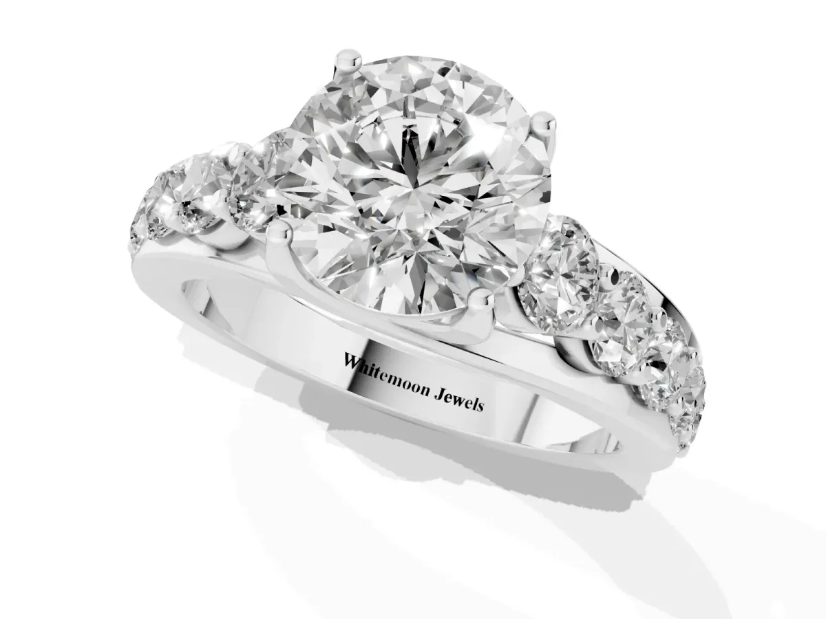 Round Cut Diamond Engagement Ring with Pavé Band and Four-Prong Setting Silver
