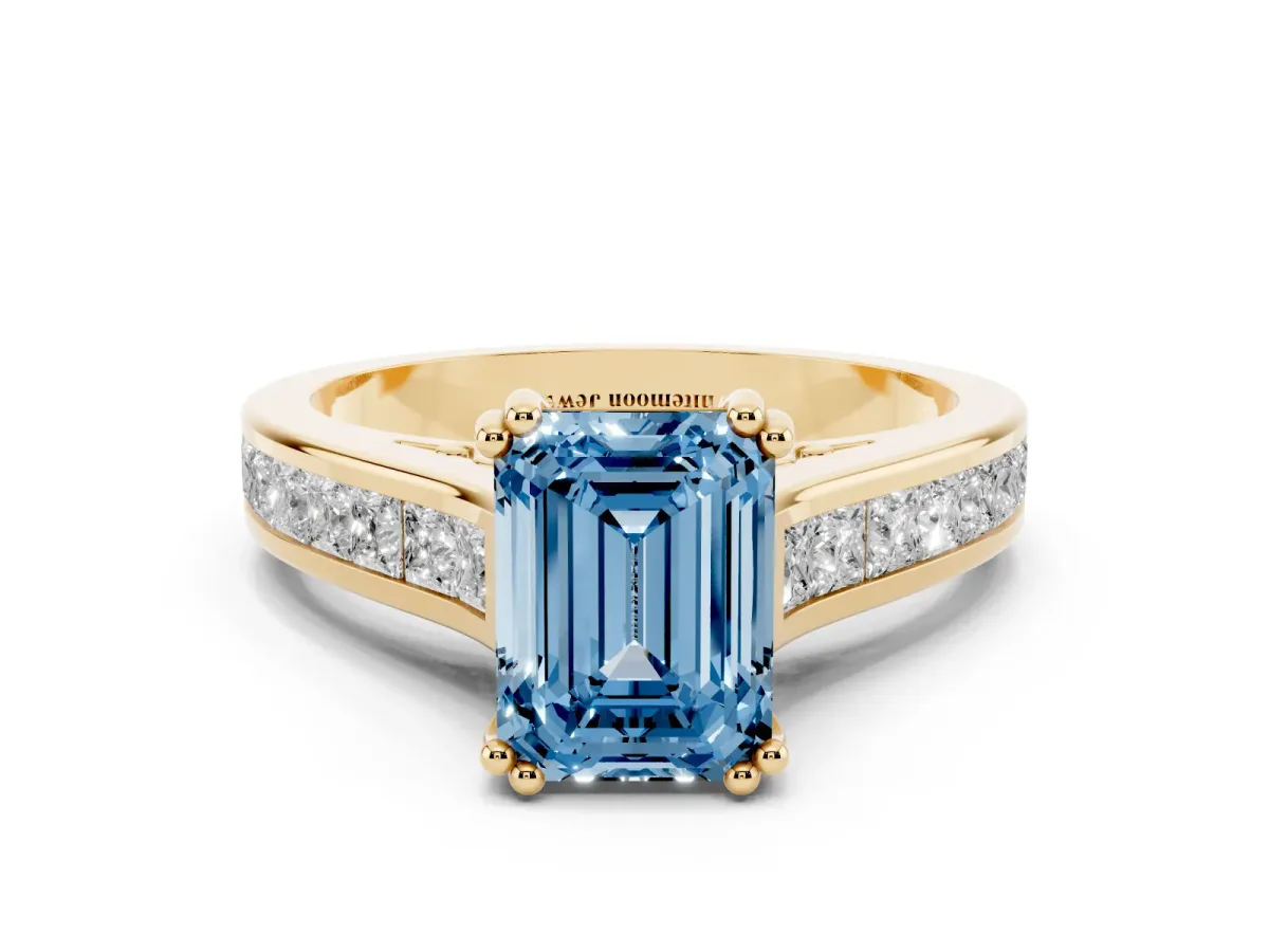 Fancy Blue Emerald Cut Cut Channel Set Solitaire Engagement Ring with Prong Setting Yellow gold