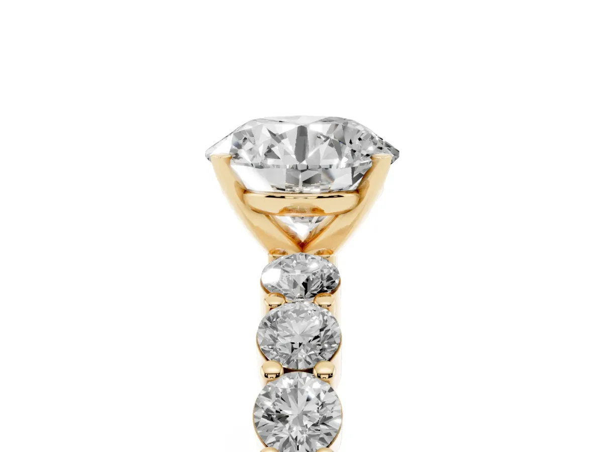 Round Cut Diamond Solitaire Ring with Shared Prong Round Side Stones Yellow gold