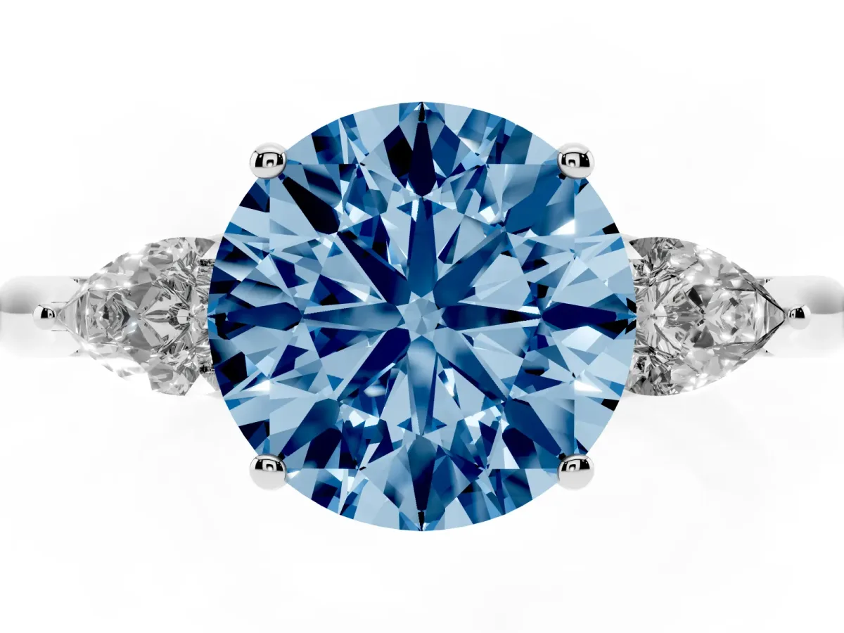 Fancy Blue Three-Stone Round Cut Diamond Ring with Pear Side Stones in Four-Prong Setting Silver