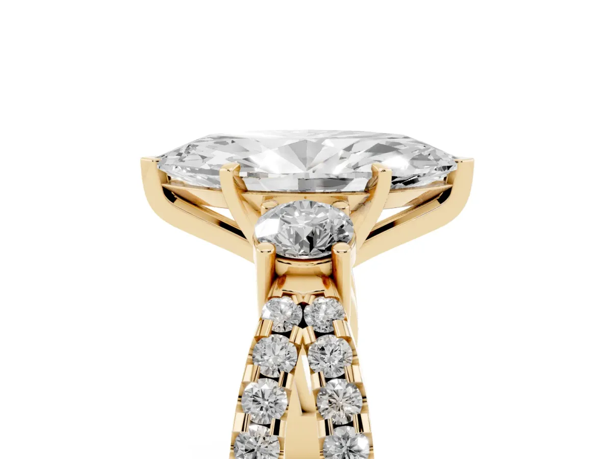 Marquise Cut Diamond Three-Stone Ring with Pavé Split Shank and Four-Prong Setting Yellow gold