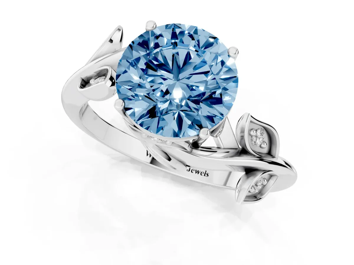 Fancy Blue Round Cut Solitaire Twist Engagement Ring with Leaf Accents and Prong Setting Silver