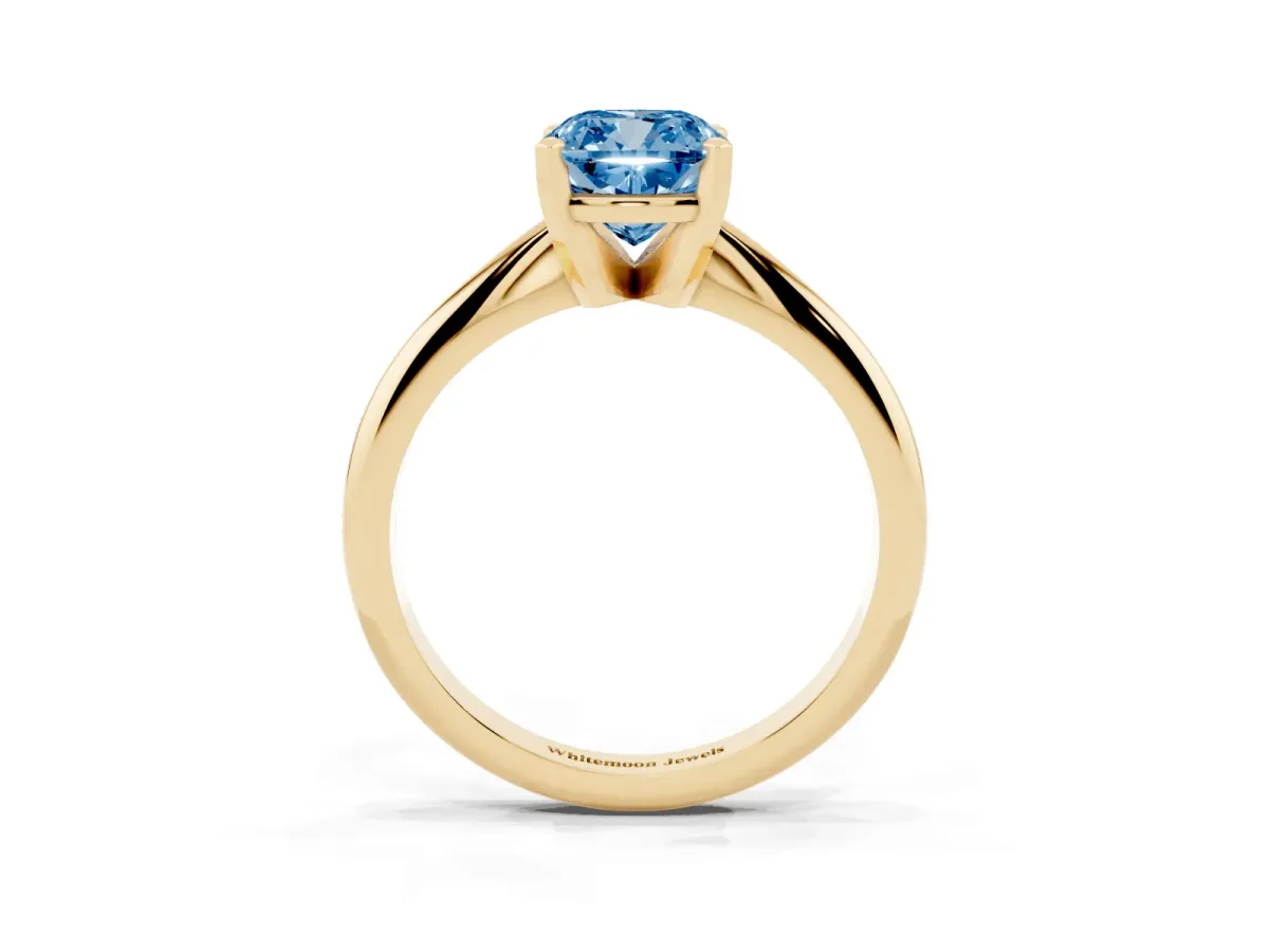 Fancy Blue Cushion Cut Cut Solitaire Ring with Four-Prong Setting on a Classic Band Yellow gold