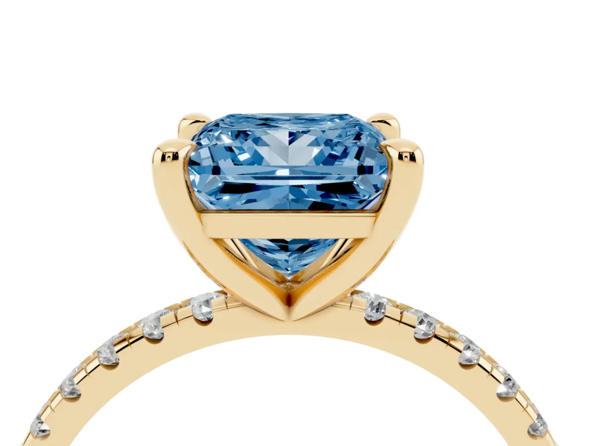 Fancy Blue Princess Cut Diamond Brilliant Solitaire Ring with Pavé Band and Four-Prong Setting Yellow gold