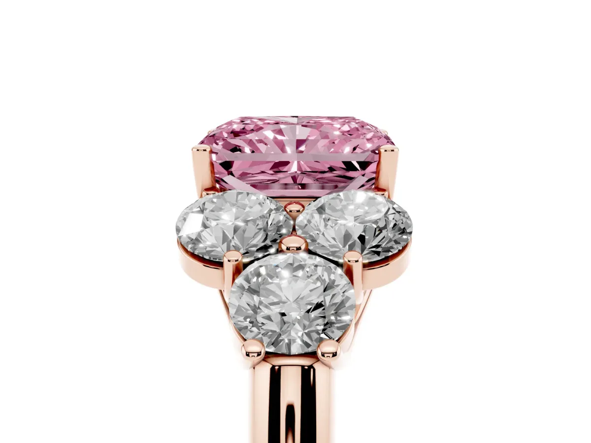 Fancy Pink Radiant Cut Cut Diamond Cluster Ring with Round Accent Stones and Prong Setting on a Classic Band Rose gold
