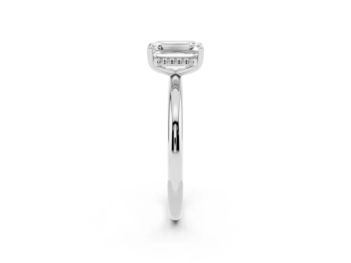 Emerald Cut Cut Solitaire Engagement Ring with Four-Prong Setting and Classic Band Silver