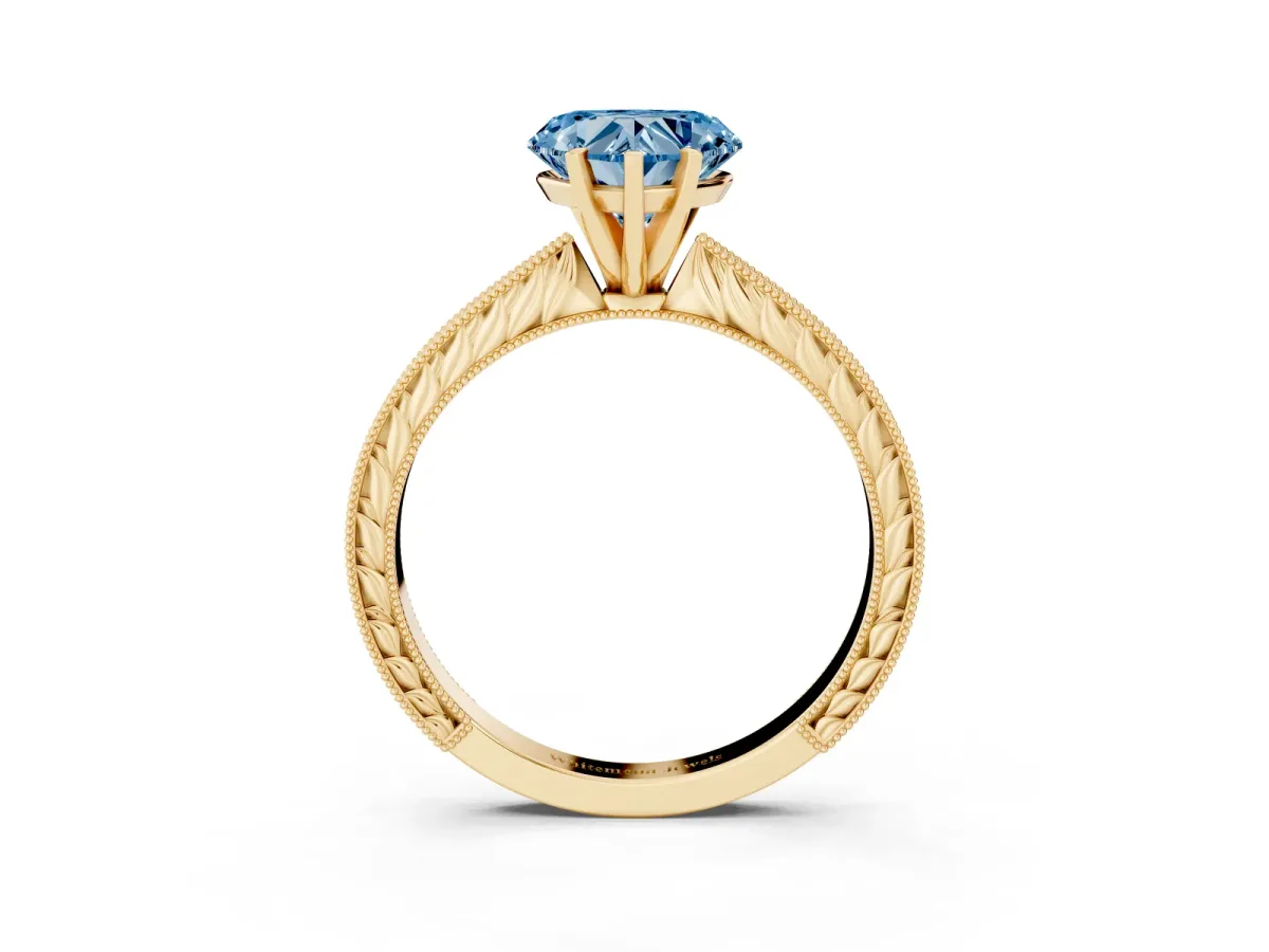 Fancy Blue Heart Cut Solitaire Milgrain Engraved Band with Four-Prong Setting Yellow gold