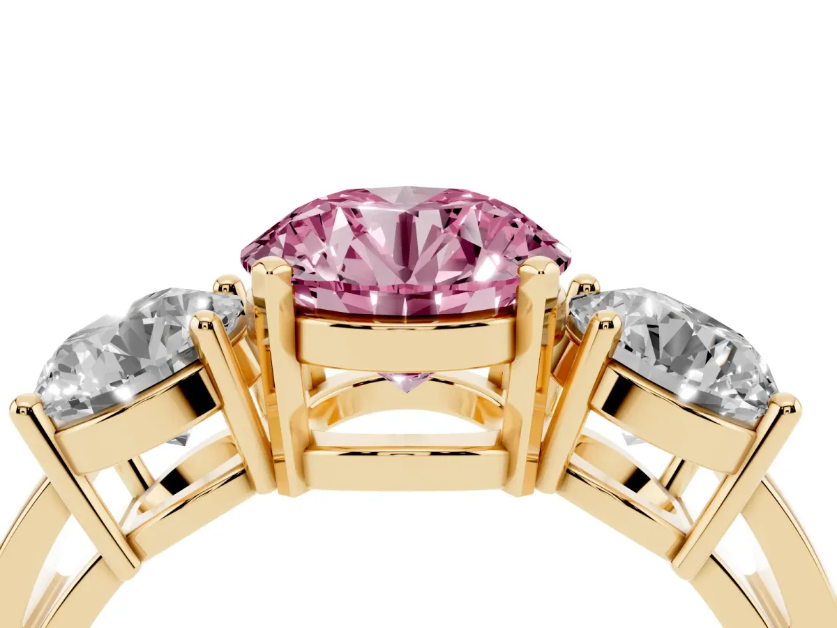 Fancy Pink Three-Stone Round Cut Diamond Ring with Round Side Stones, Classic Band, and Four-Prong Setting Yellow gold