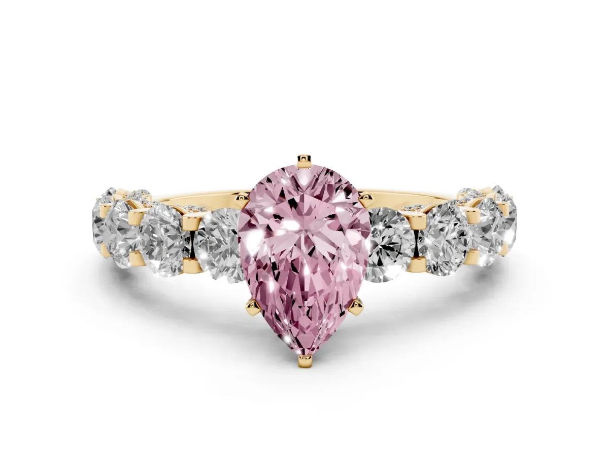 Fancy Pink Pear Cut Diamond Side Stone Engagement Ring with Four-Prong Setting Yellow gold