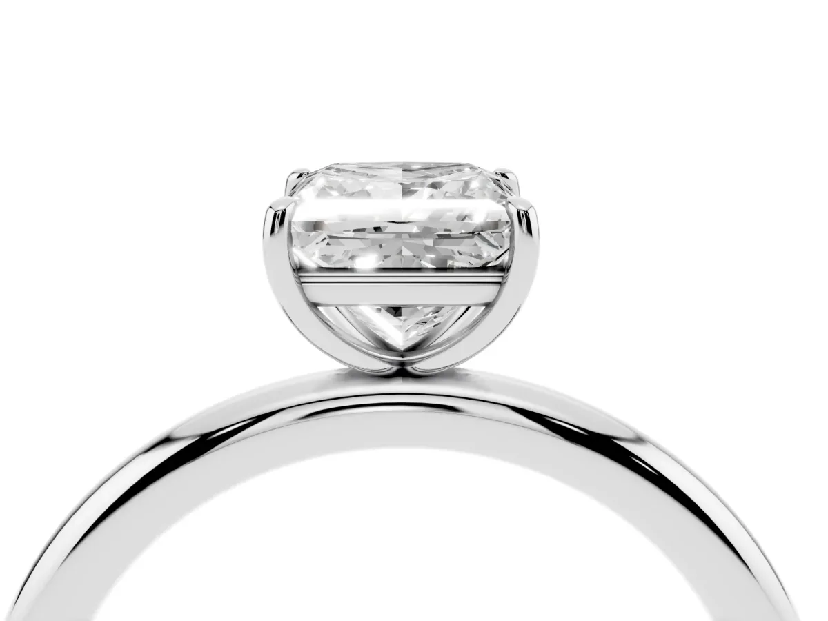 Princess Cut Solitaire Diamond Ring with Four-Prong Setting on a Plain Band Platinum