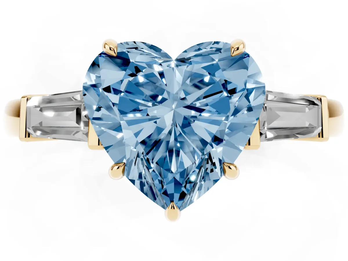 Fancy Blue Heart Cut Diamond Three-Stone Ring with Tapered Baguette Side Stones and Prong Setting Yellow gold
