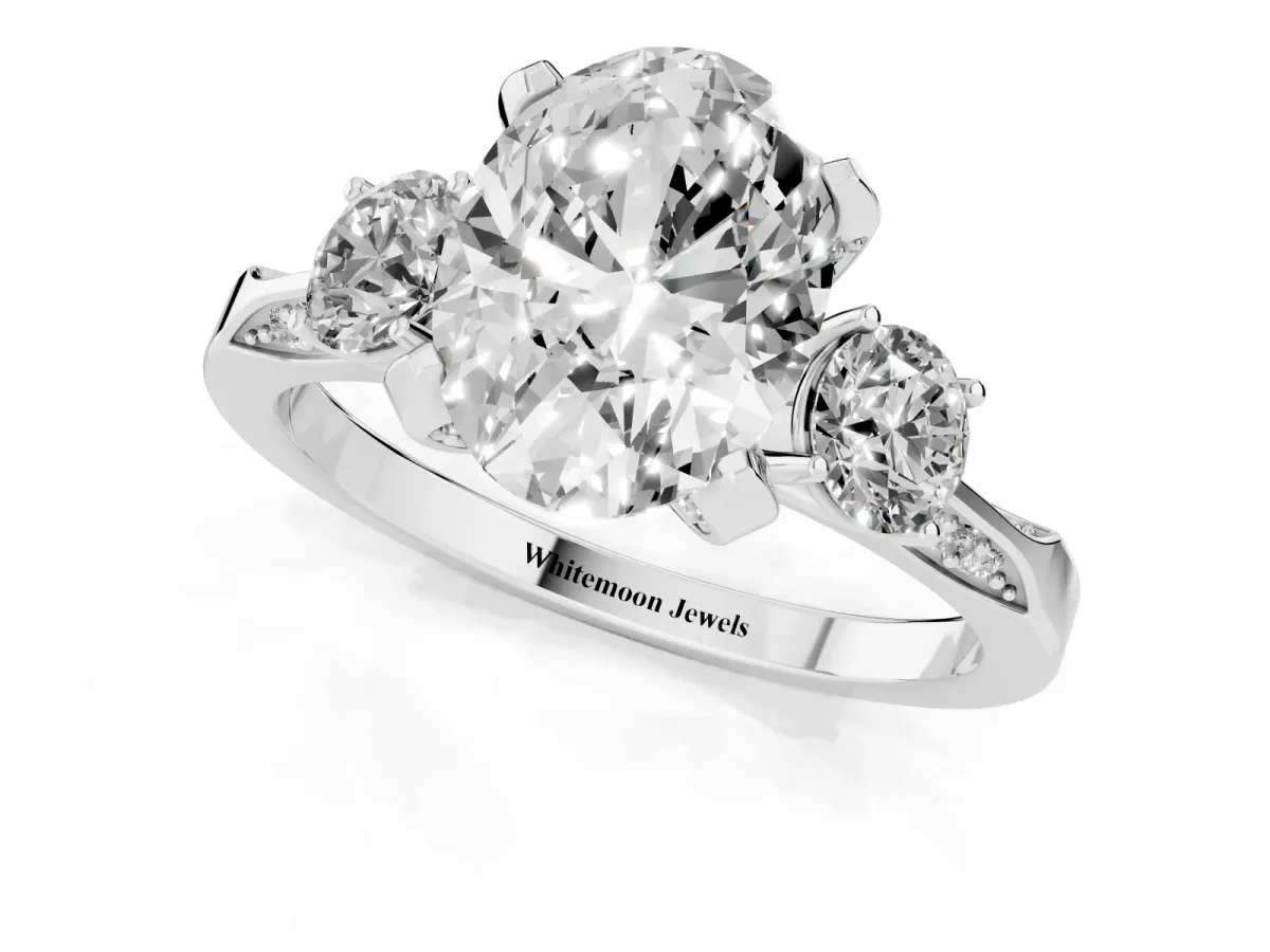 Oval Cut Brilliant Three-Stone Diamond Ring with Pavé Band and Four-Prong Setting Silver