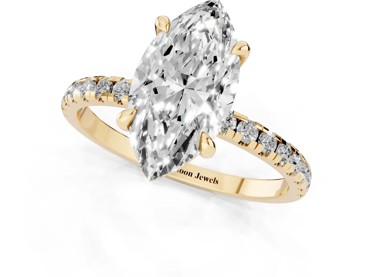 Marquise Cut Diamond Brilliant Solitaire Ring with Pavé Band and Four-Prong Setting Yellow gold