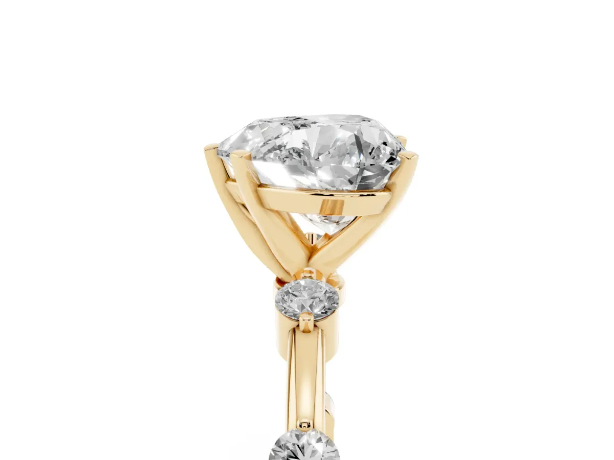 Heart Cut Solitaire Diamond Ring with Bezel Set Side Stones and Prong Setting Yellow gold