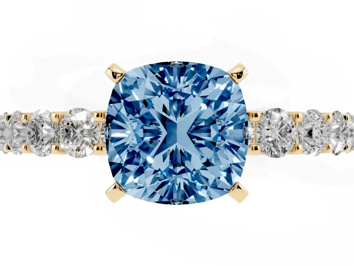 Fancy Blue Cushion Cut Diamond Solitaire Ring with Shared Prong Pavé Band and Four-Prong Setting Yellow gold