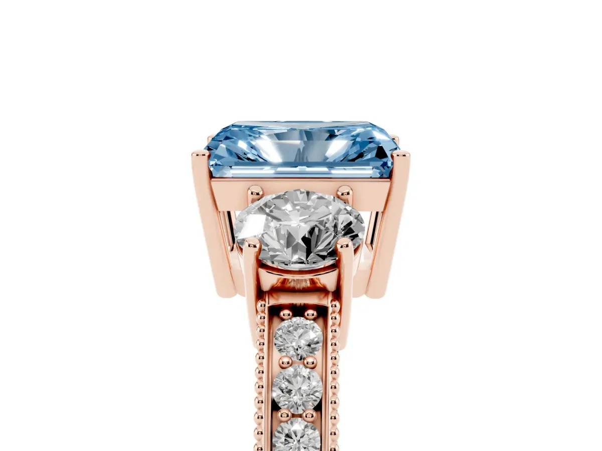 Fancy Blue Radiant Cut Three-Stone Diamond Ring with Pavé Band and Four-Prong Setting Rose gold