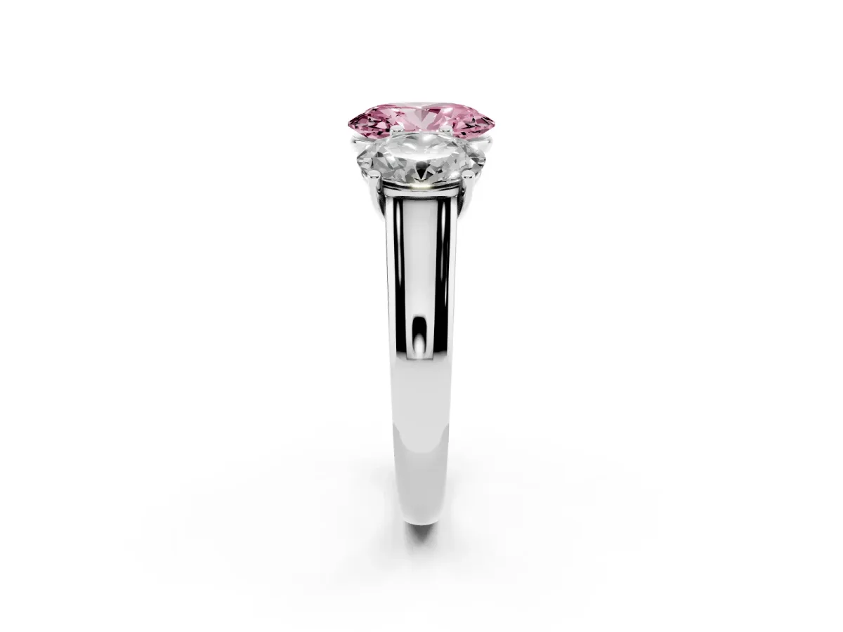 Fancy Pink Oval Cut Three-Stone Diamond Ring with Prong Setting on a Classic Band Platinum