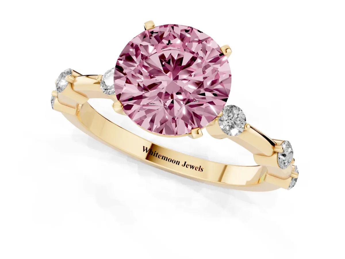 Fancy Pink Round Cut Solitaire Diamond Ring with Bezel Set Side Stones and Prong Setting Yellow gold