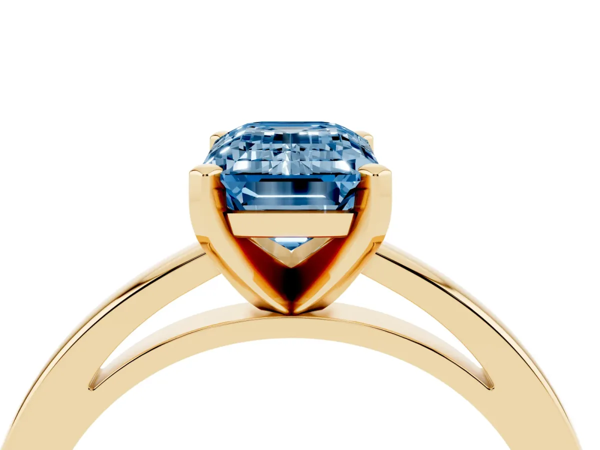 Fancy Blue Emerald Cut Solitaire Diamond Engagement Ring with Four-Prong Setting on a Classic Band Yellow gold