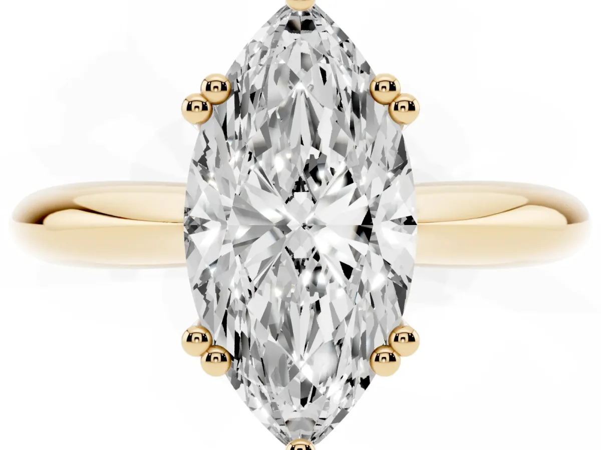 Marquise Cut Cut Solitaire Engagement Ring with Tapered Band and Four-Prong Setting Yellow gold