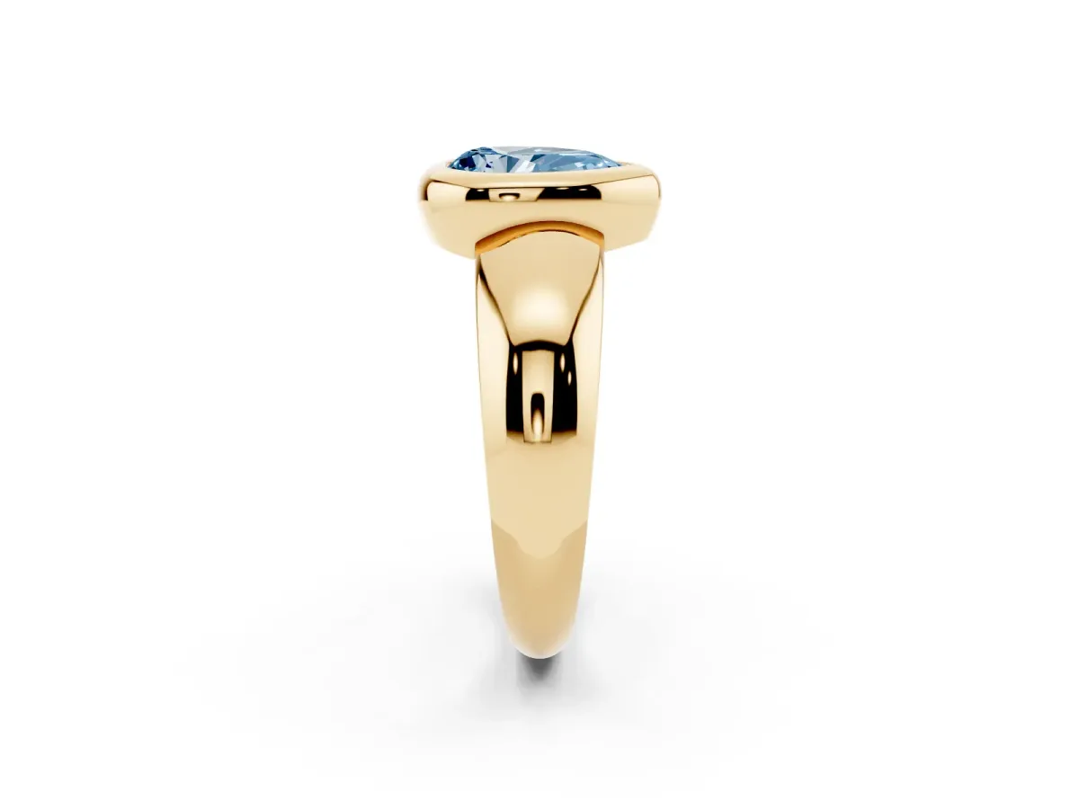 Fancy Blue Bezel Set Pear Cut Solitaire Ring with Wide Band Yellow gold