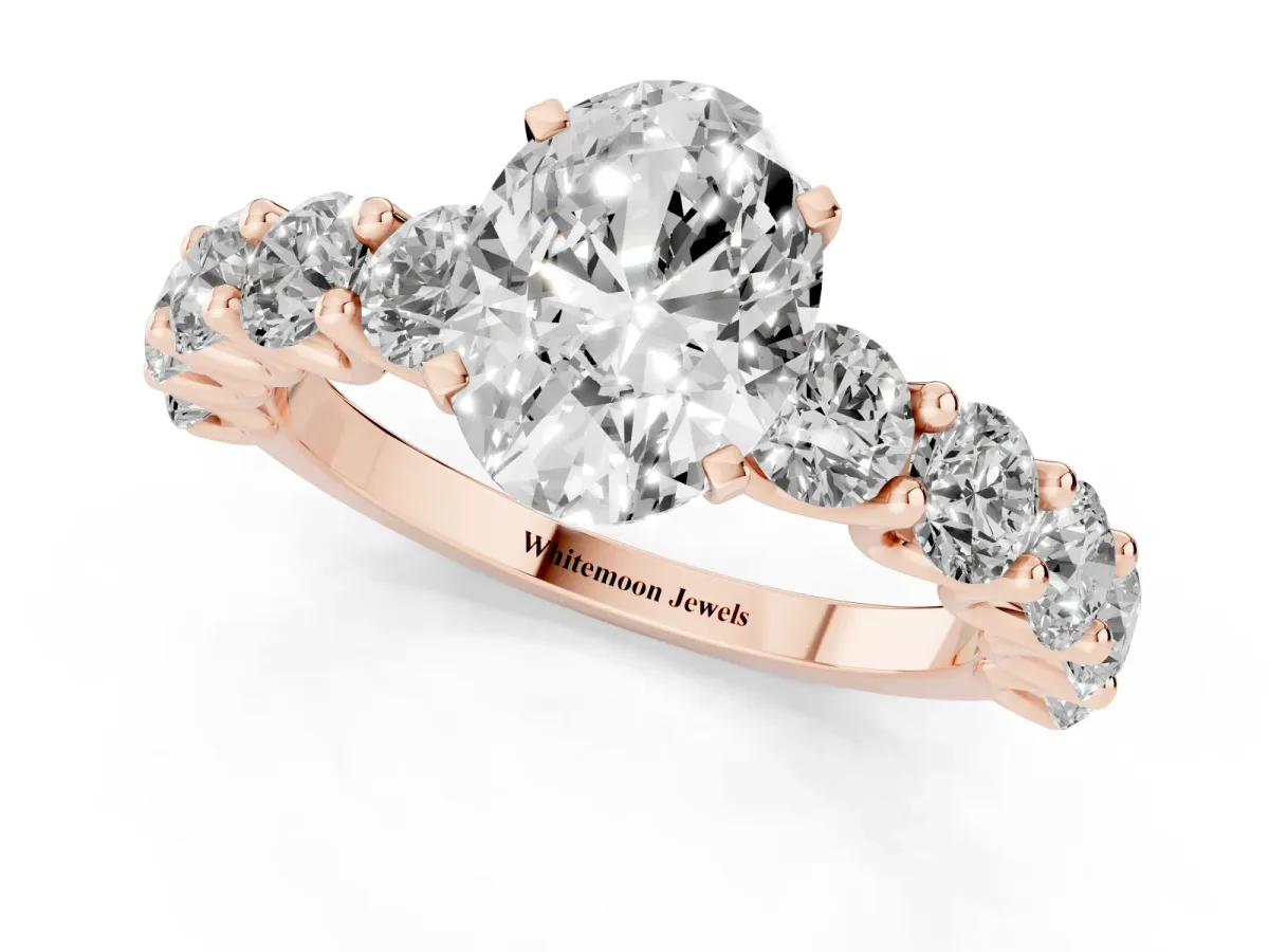 Oval Cut Diamond Prong Setting with Side Stones on a Pave Band Rose gold