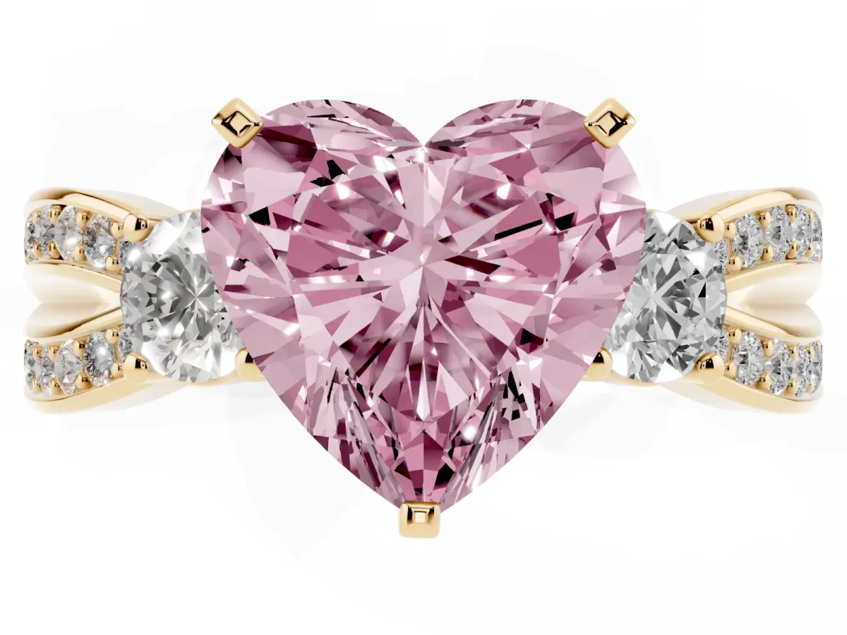 Fancy Pink Three-Stone Heart Cut Cut Diamond Twist Band with Prong Setting Yellow gold