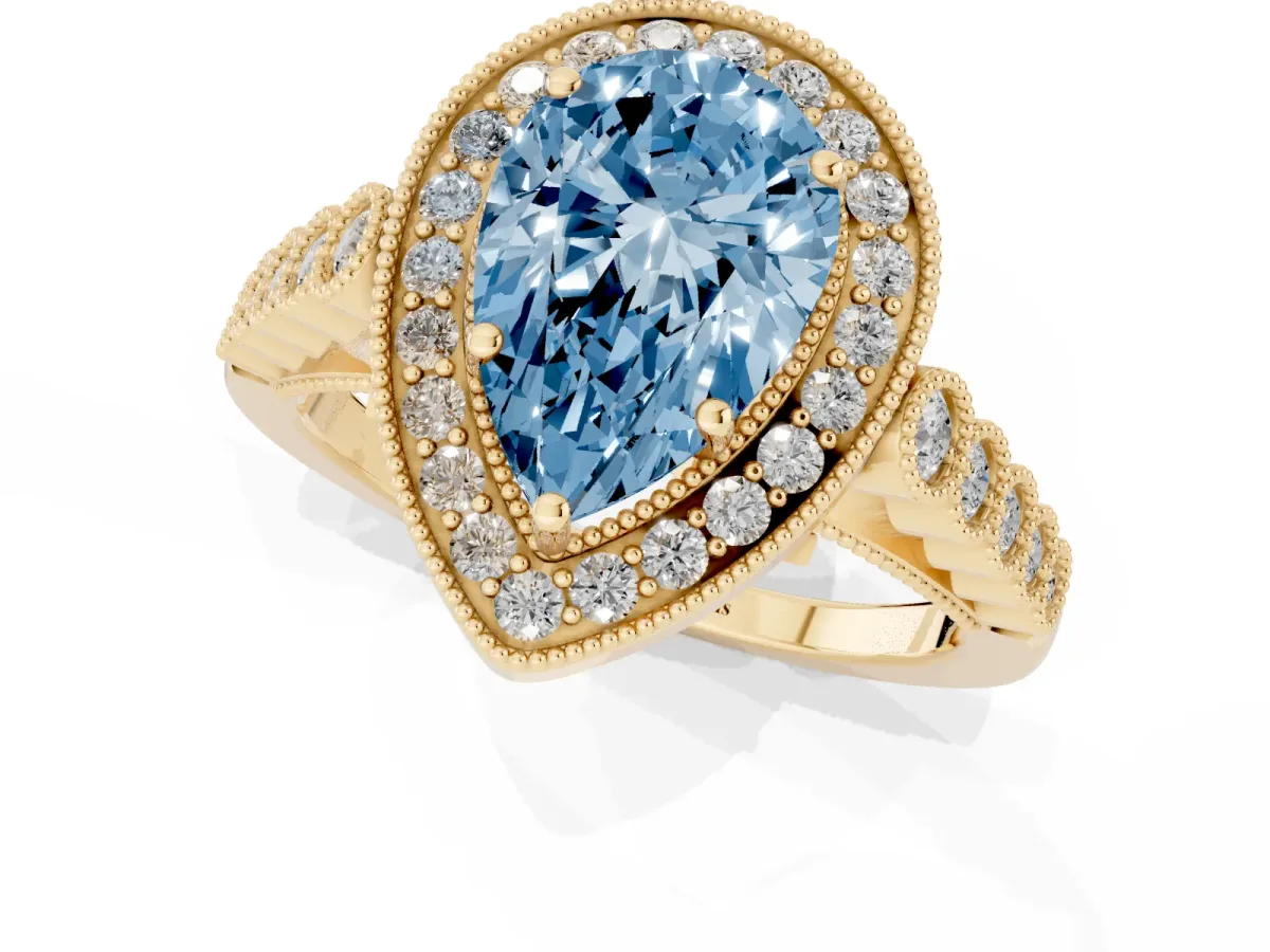 Fancy Blue Pear Cut Halo Milgrain Solitaire with Bezel Set Side Stones and Pave Band Yellow gold