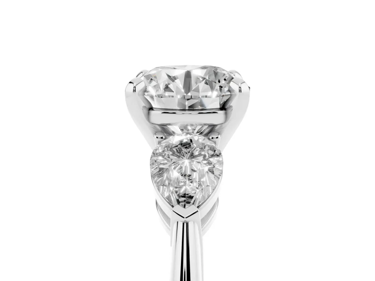 Three-Stone Round Cut Diamond Ring with Pear Side Stones and Four-Prong Setting Silver