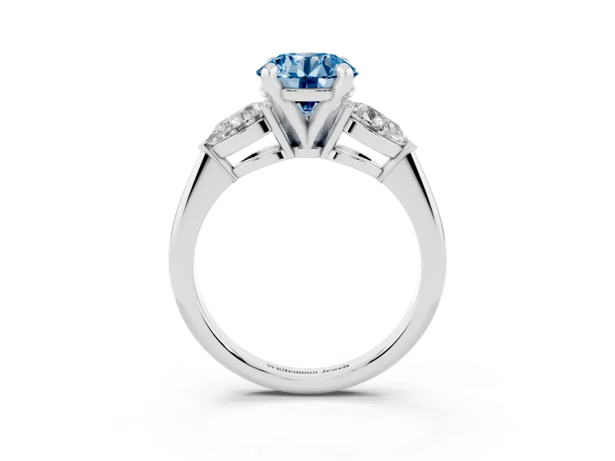 Fancy Blue Three-Stone Round Cut Diamond Ring with Pear Side Stones and Four-Prong Setting Platinum