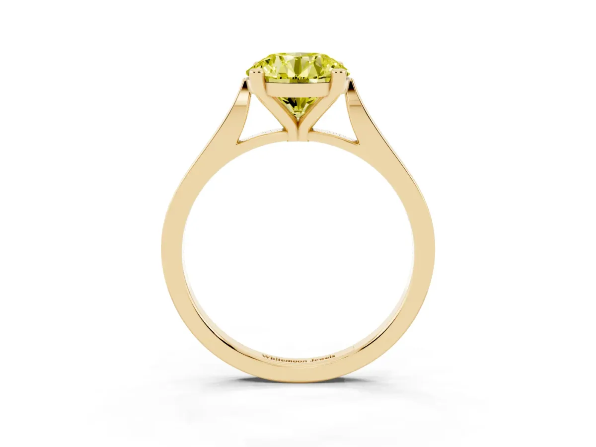 Fancy Yellow Round Cut Solitaire Diamond Ring with Four-Prong Setting and Tapered Band Yellow gold