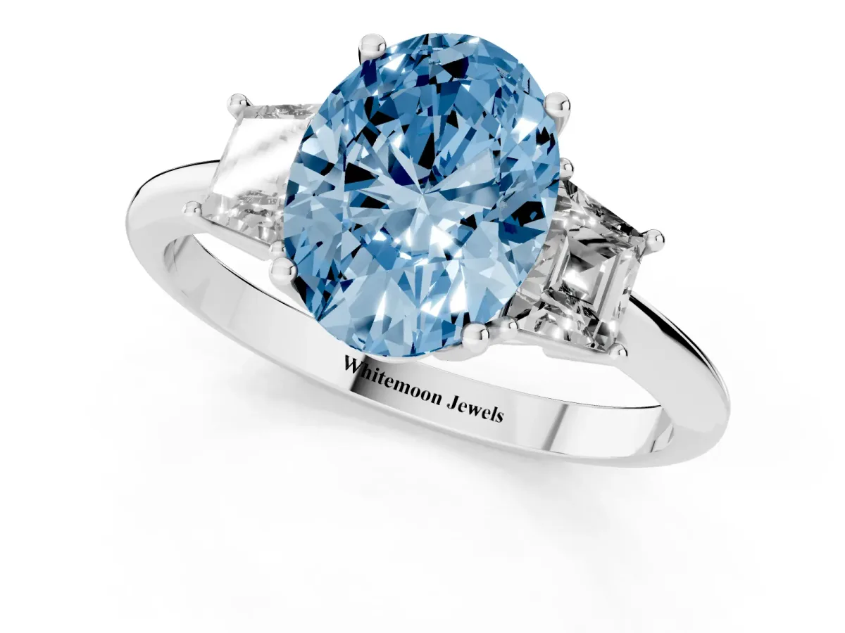 Fancy Blue Oval Cut Diamond Three-Stone Ring with Trapezoid Side Stones and Prong Setting Silver